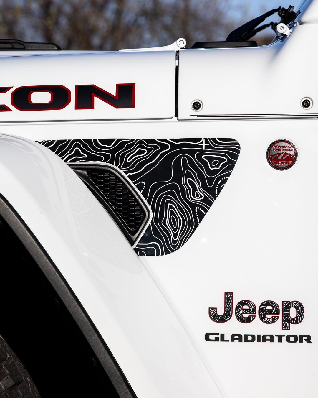 Image of jeep with custom hood and body lettering.