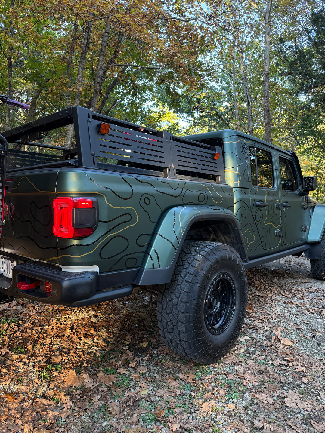 Rear view of topo graphics wrapping the bed side and taillight