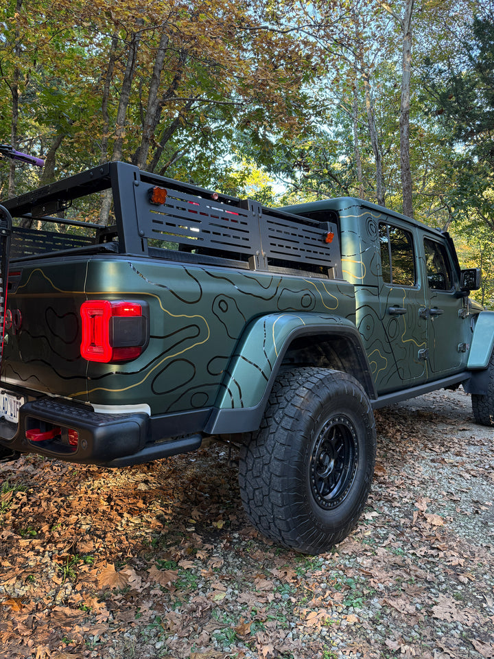Rear view of topo graphics wrapping the bed side and taillight