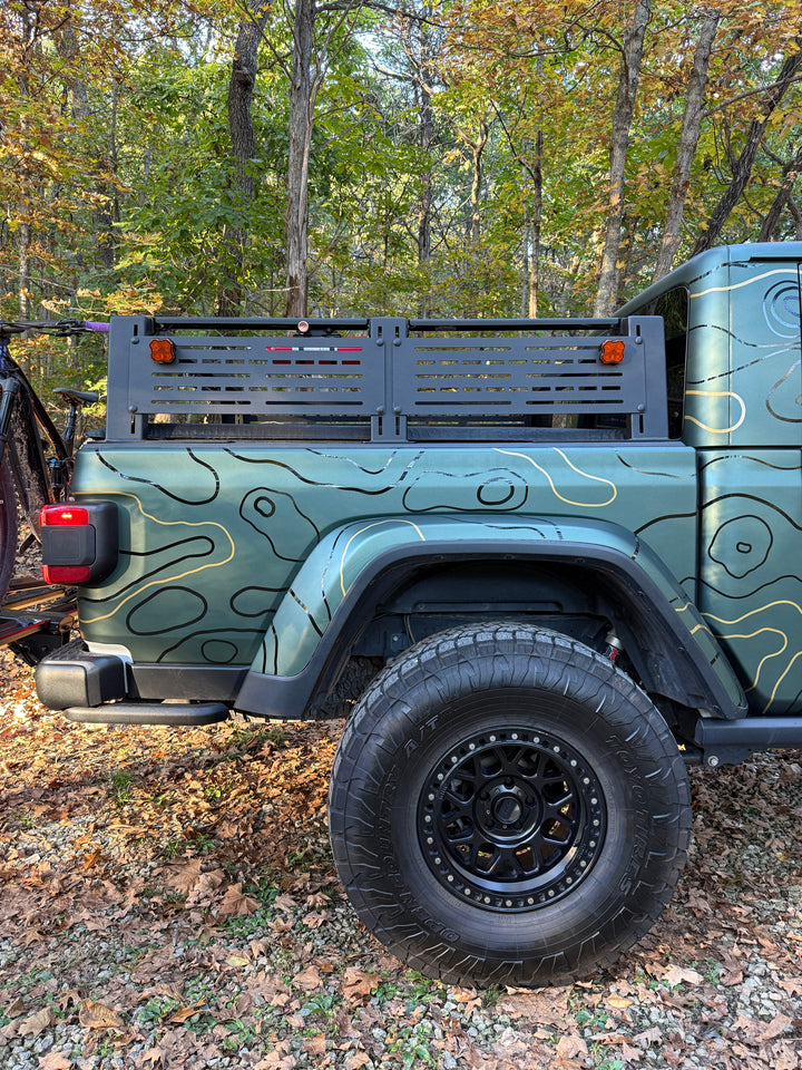 DIY Topo Kit black and metallic gold topo lines on the bed side of a green pickup